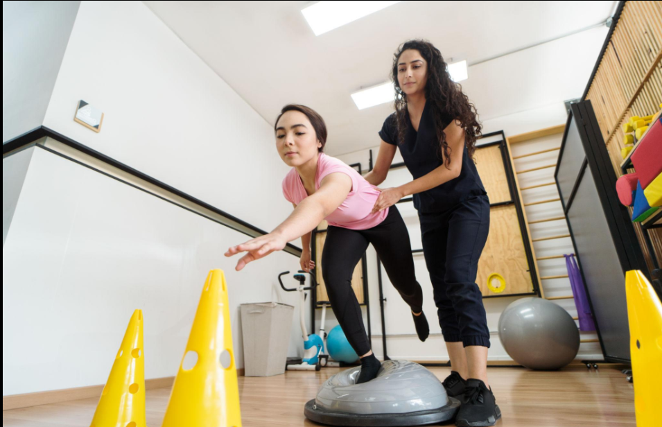 Physiotherapist guiding a patient through neurological physiotherapy exercises for hemiparesis recovery